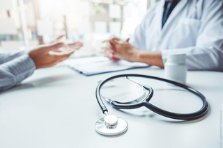 stethoscope, hands of two humans