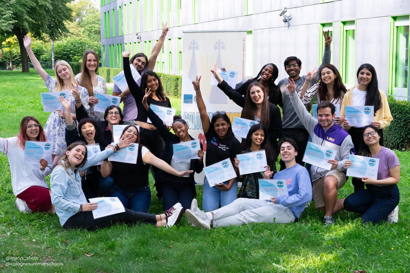 Group of students with certificates in hands