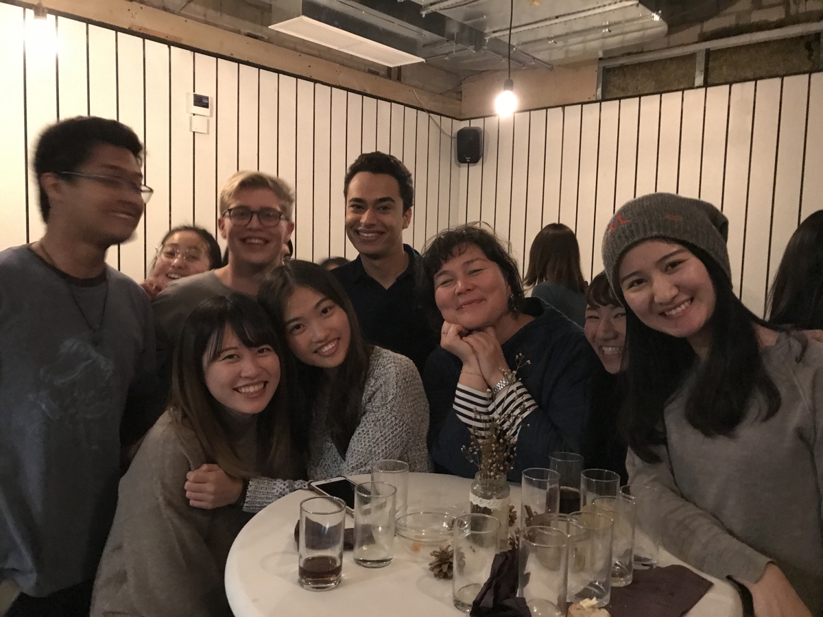 Students and Heike Berner smiling and looking at the camera.